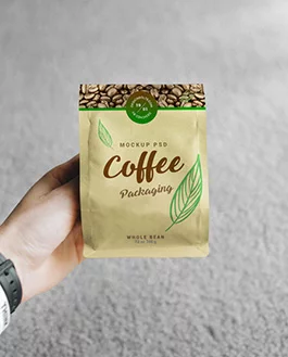 Free Hand Holding Coffee Bag Packaging Mockup PSD