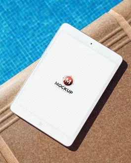 Free iPad PSD Mockup Beside Swimming Pool