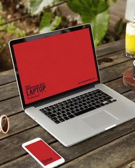 Free Smartphone With Laptop PSD Mockup on Wooden Table