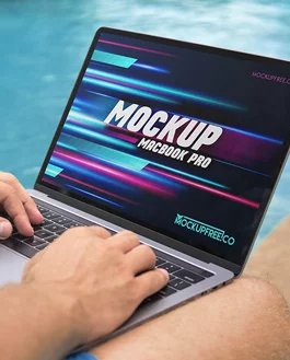 Freelancer Working on MacBook Pro Free PSD Mockup